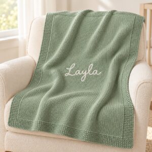 Layla blanket draped over a nursery chair