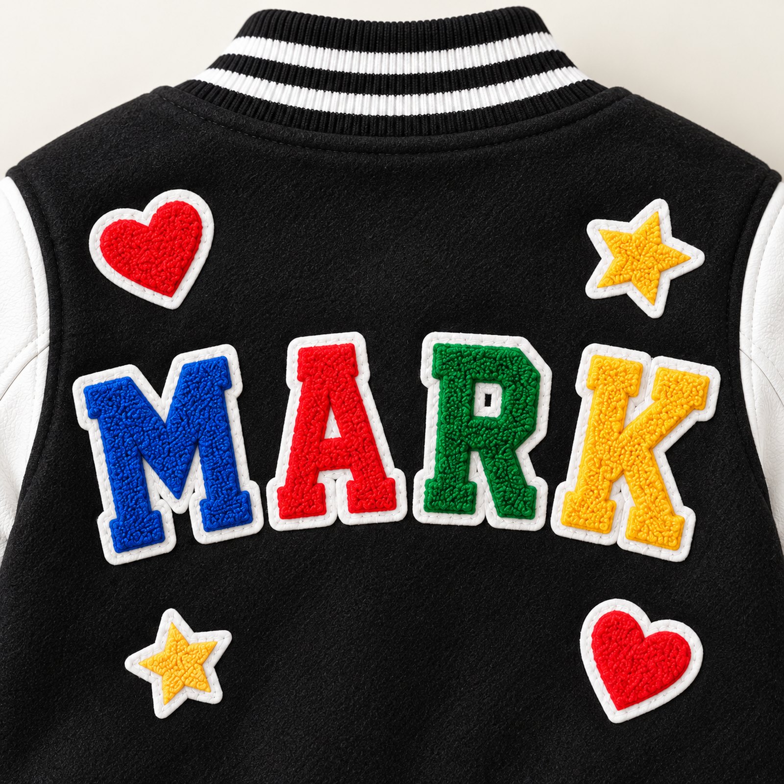 Close view of MARK letter patches and striped collar